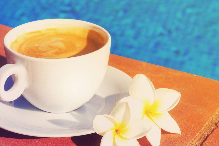 hawaiian cup of coffee and flower - hawaiian coffee industry - gojoebean